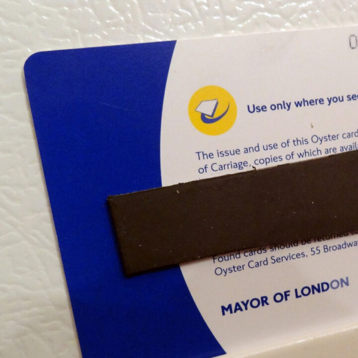 Glue magnets to the back of travel souvenirs to create travel-themed magnets