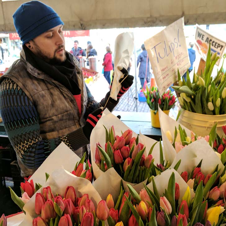 Bouquets being packaged at pike place market.