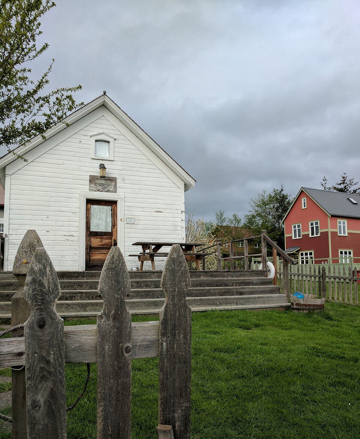 A white house on a green lawn.