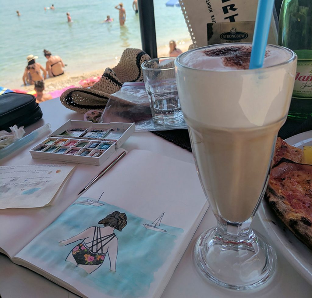A sketch of a swimmer in a travel journal.