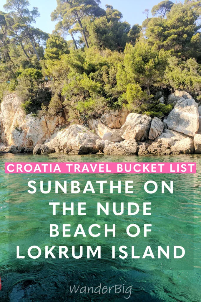 Turquoise green waters of the adriatic sea with craggy rocks and trees.