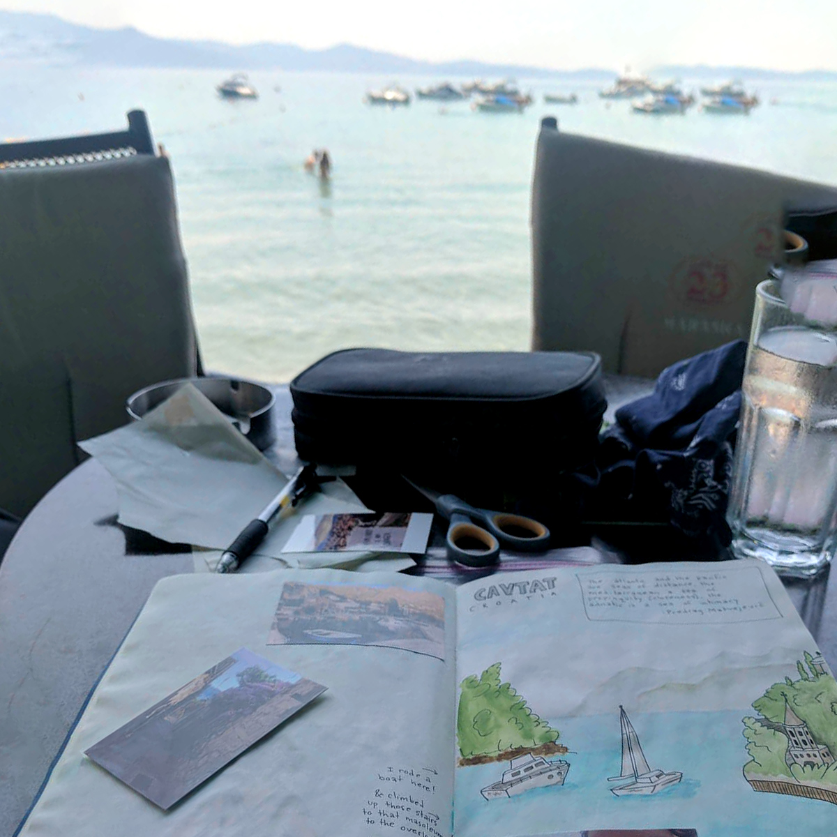 Travel journal drawing with seaside croatian landscape in backdrop.