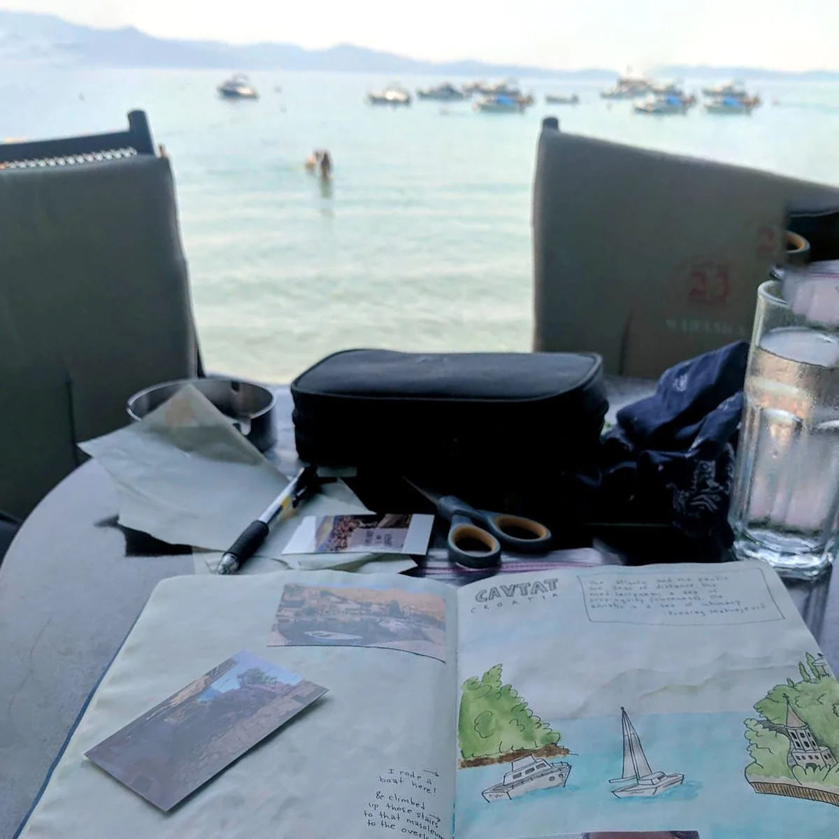 Travel journal drawing with seaside croatian landscape in backdrop.