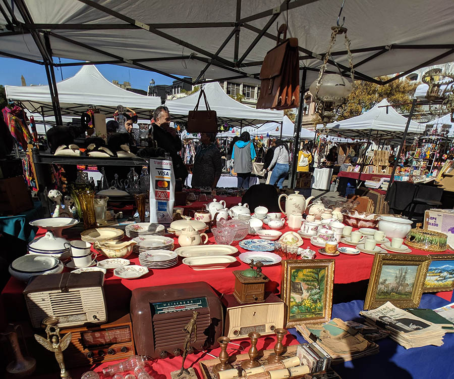 An antique sellers booth in a pop-up market in valparaiso, chile