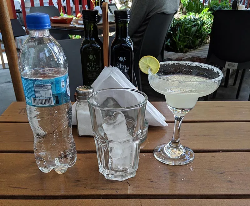 Water and alcoholic drinks on a table in san pedro de atacama in the atacama desert.