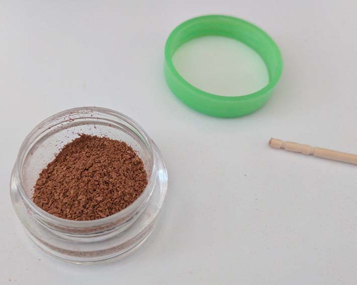 Loose powder in travel container