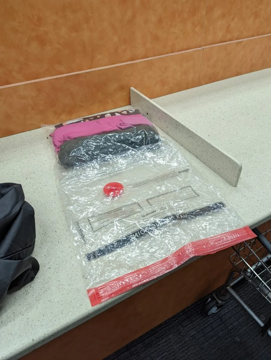 Clothing packed in a vacuum compression bag