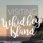 Visiting whidbey island t text over a sunset scene on whidbey.