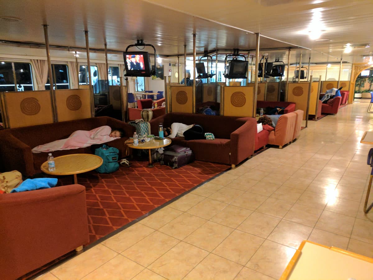 Economy deck passengers sleeping on couches aboard ferry "zadar"