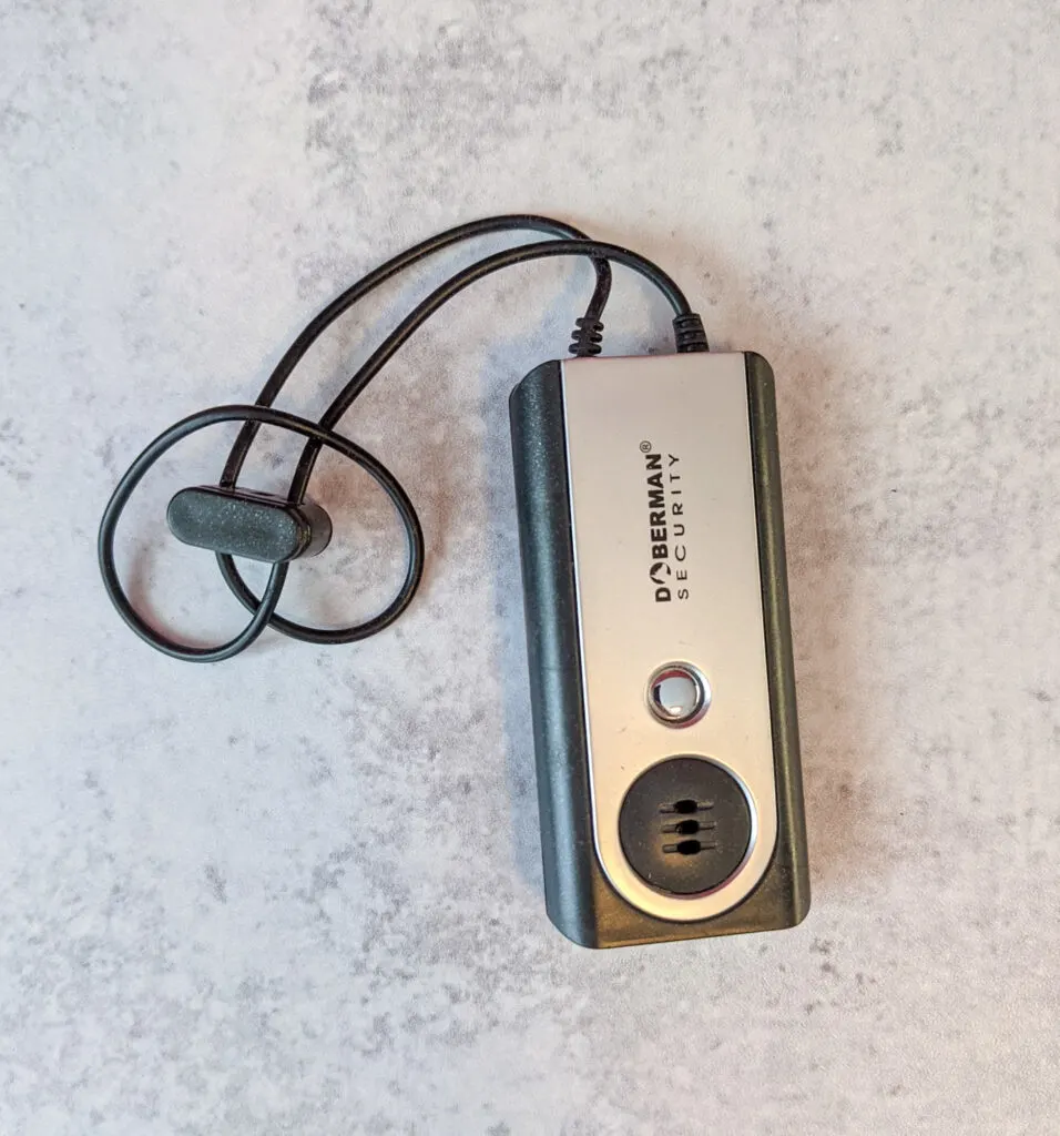 A image of a portable door alarm made for travelers.