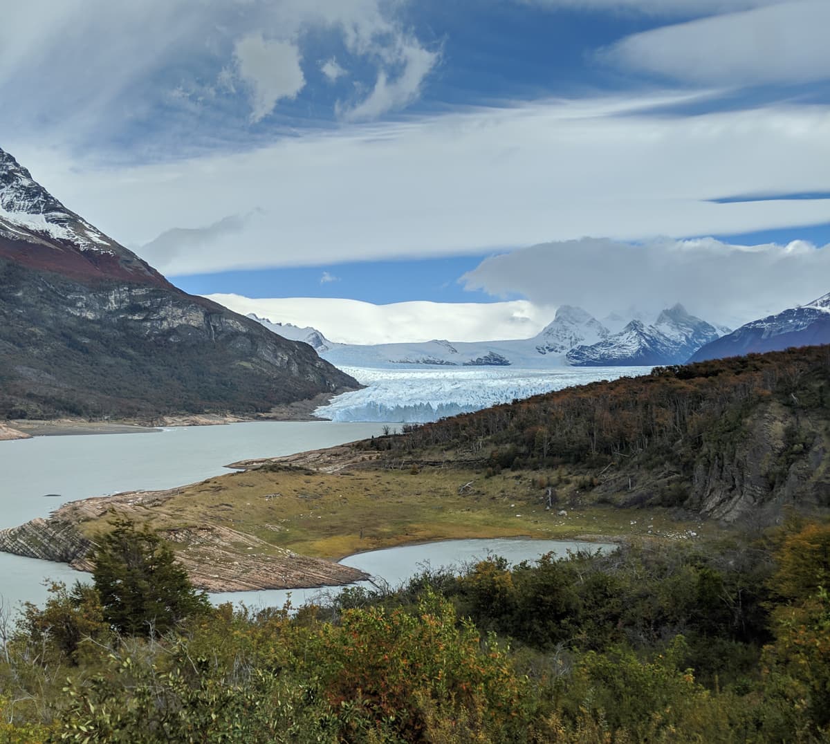 The glacier advancing in a valley.