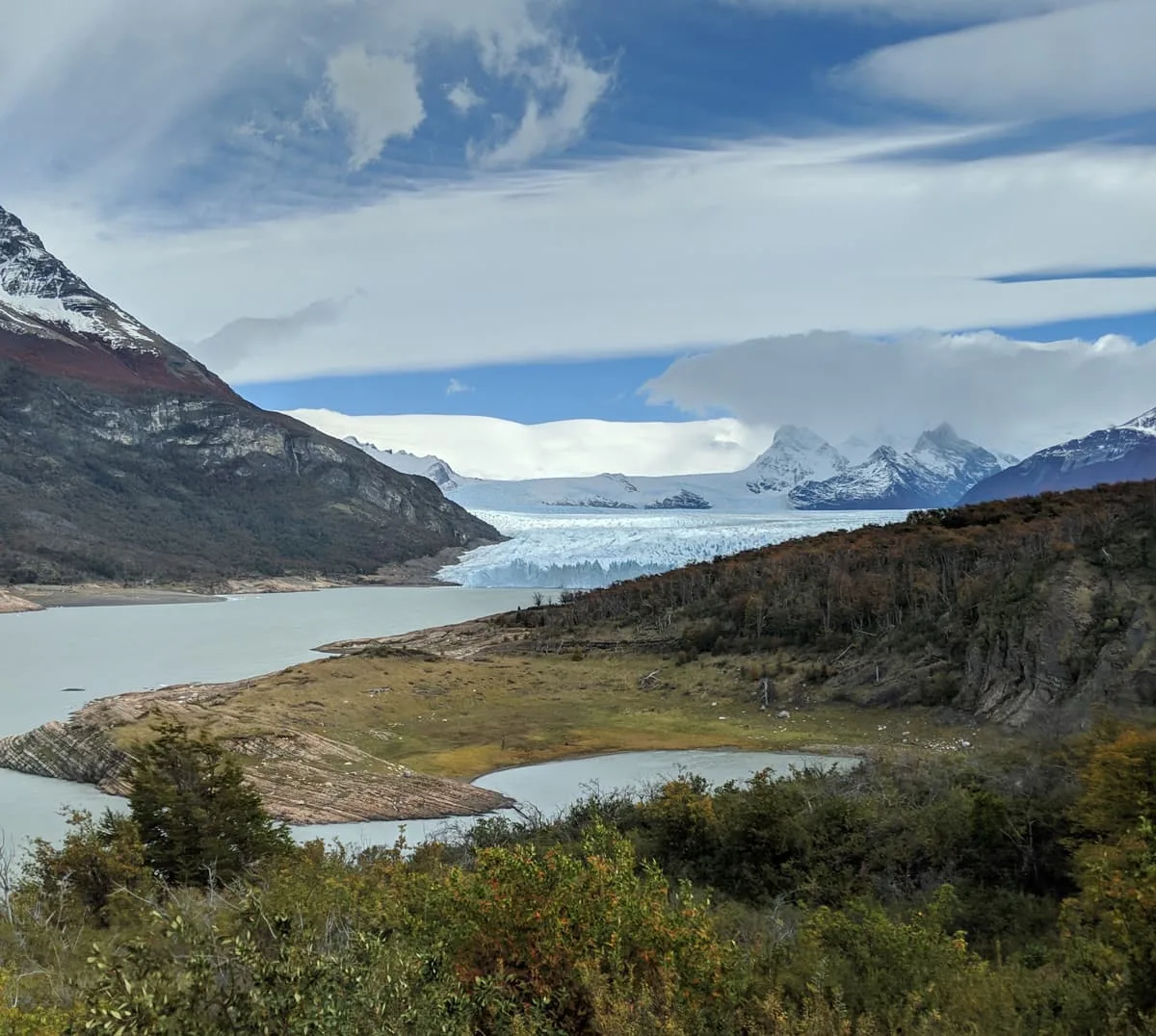 The glacier advancing in a valley.