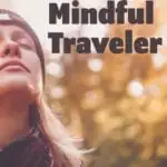 A female traveler closes her eyes to savor the nature around her.