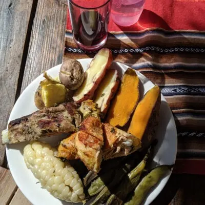 Joining a traditional peruvian pachamama meal during a machu picchu trip