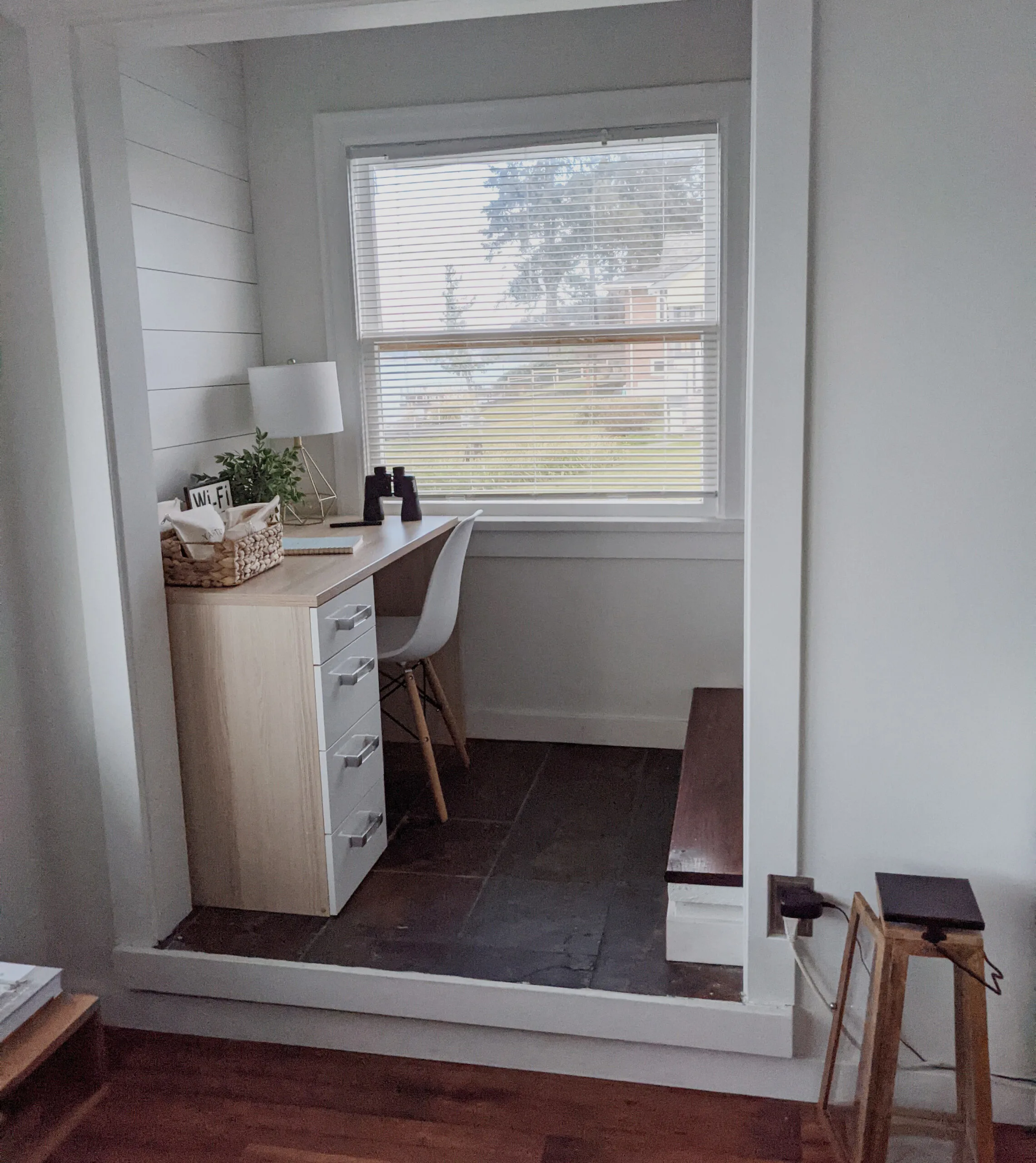 An airbnb office nook with an unsuitable chair.