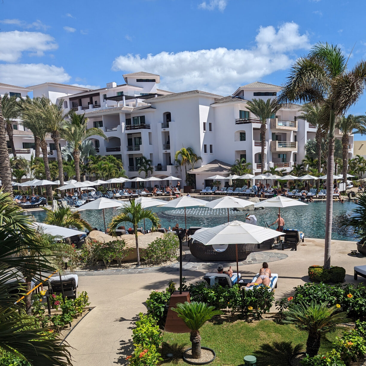 Travelers rest by the pool at an all inclusive resort in mexico.