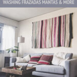 An andean woven blanket frazada hanging in an office as a wall hanging