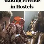 10 secrets for making friends in hostels is written in text over an image of two travelers having a conversation in a hostel.