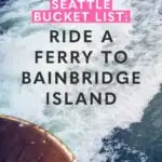 Text reads: seattle bucket list: ride a ferry to bainbridge island with an image of a ferry wake in the background.