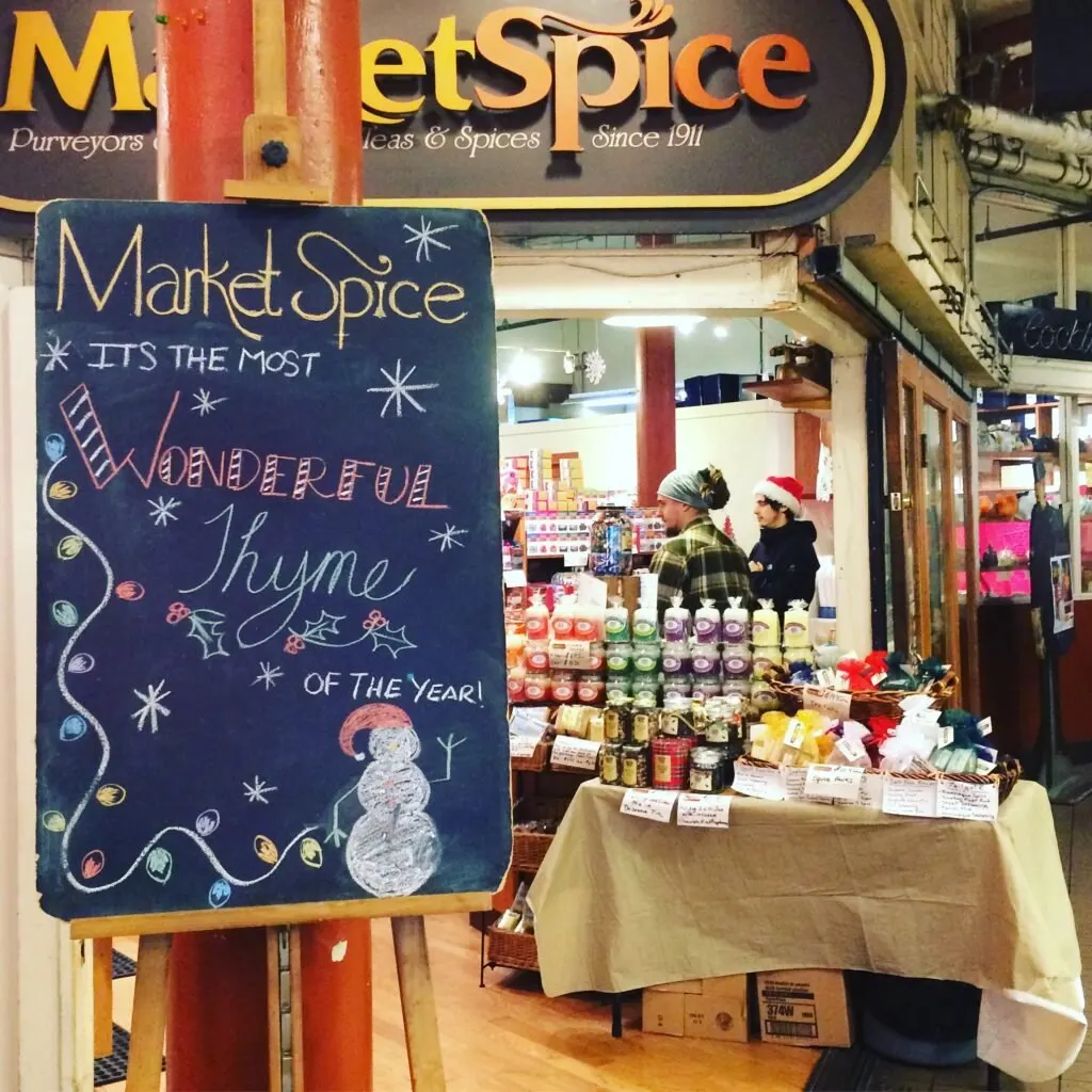 Pike place market herb store with christmas sign.