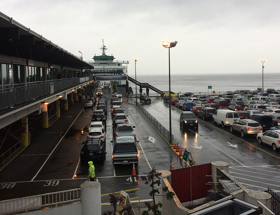 Cars lined up to board a washington state ferry bound for bainbridge island.