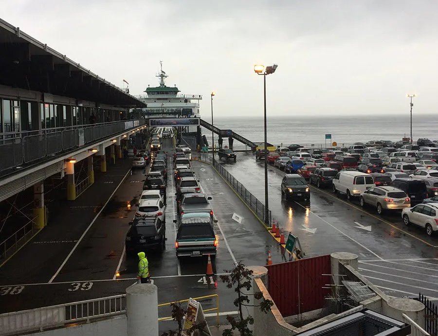 Cars lined up to board a washington state ferry bound for bainbridge island.