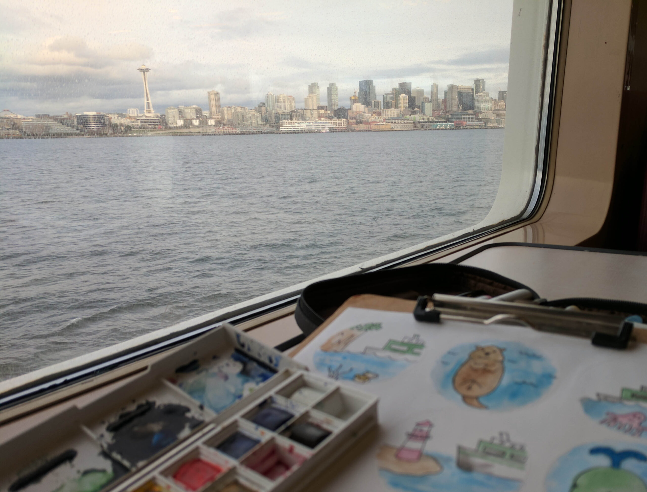 The space needle as seen from the bainbridge return washington state ferry.