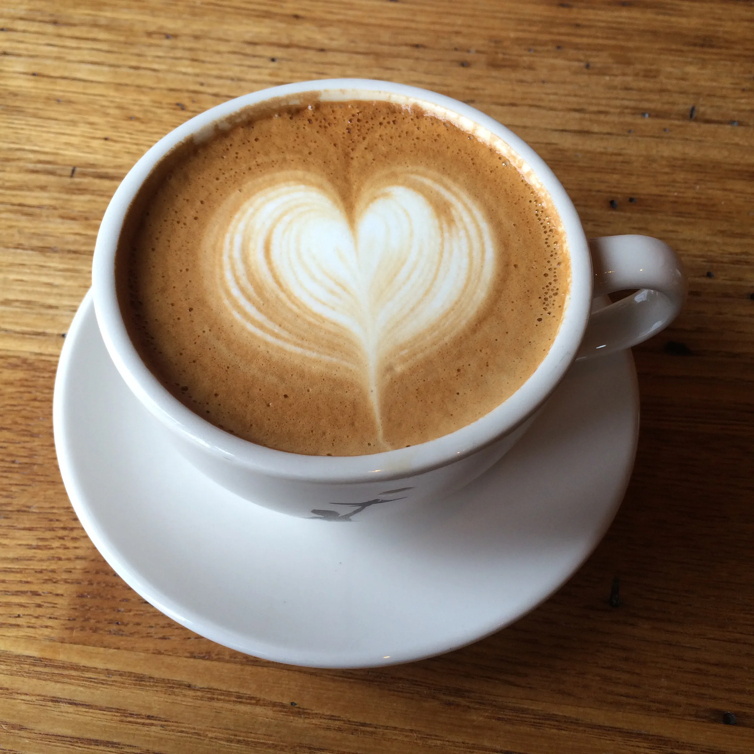 A latte with heart-shaped latte art.