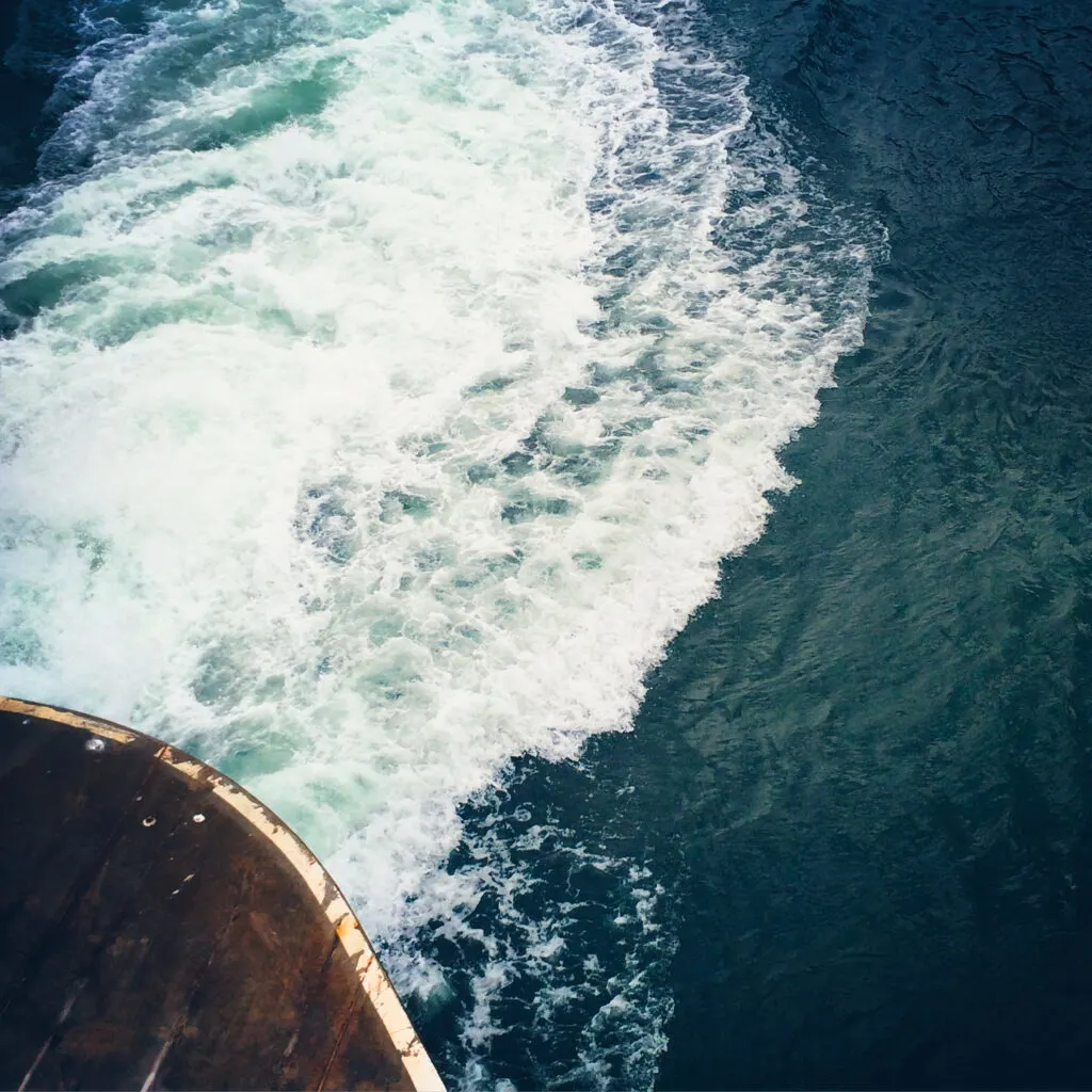A foamy wake left behind a washington state ferry.
