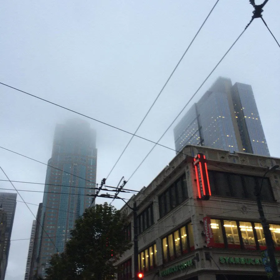 Fog obscures skyscrapers just outside of pike place market in seattle.
