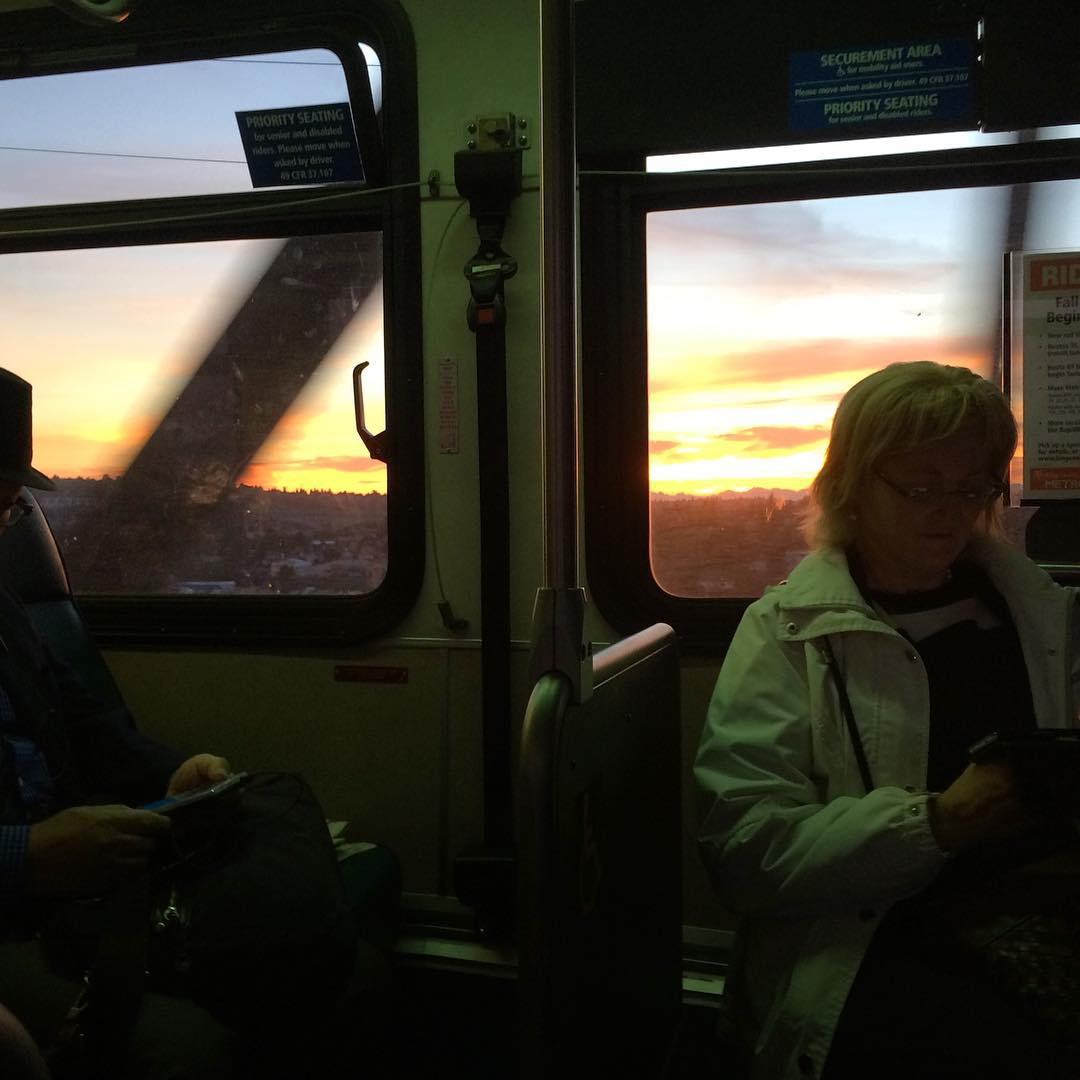 A bright sunset as seen from seattle public transportation.