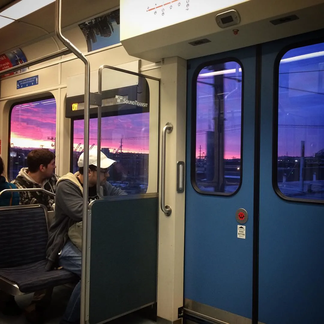 Sunset as seen from seattle's link sound transit light rail train.