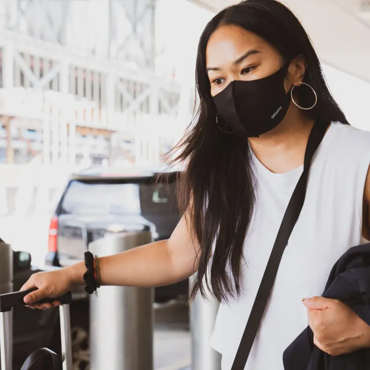 a masked woman traveling alone.