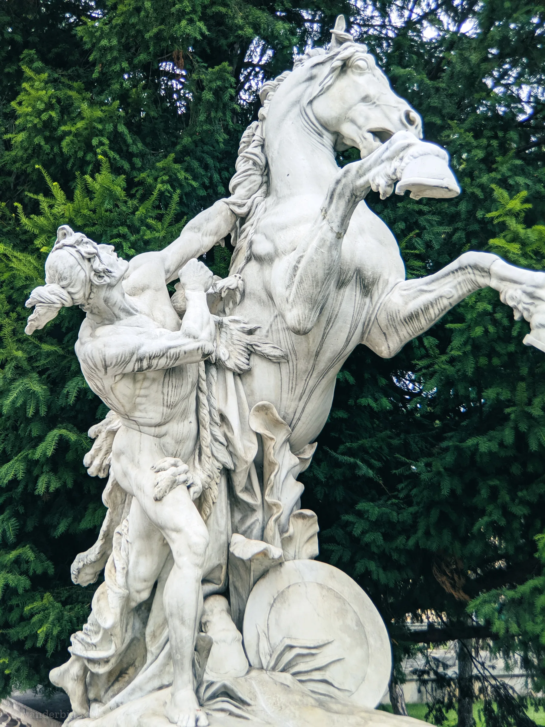 And equestrian statue near a tomb in eastern europe.