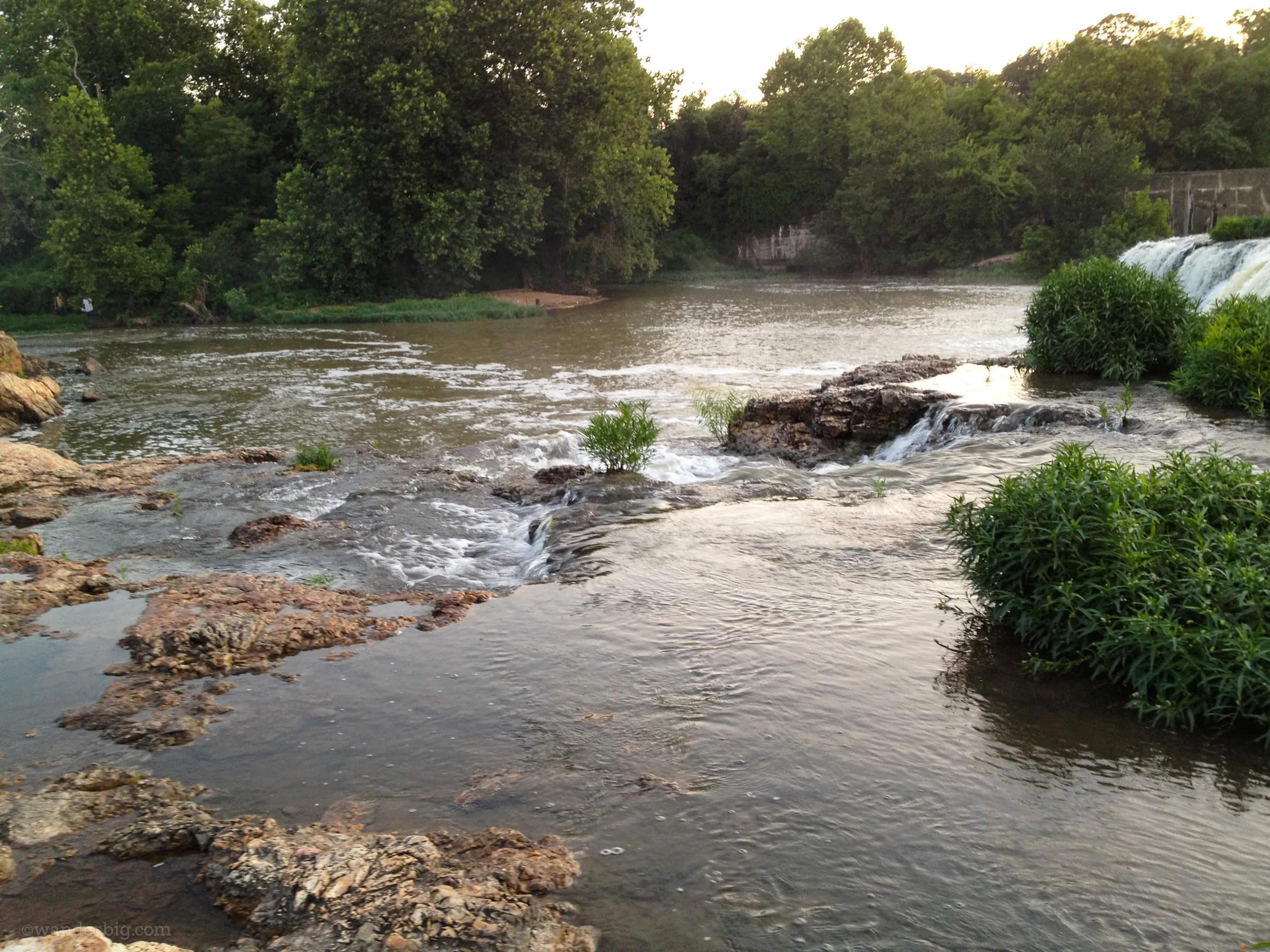 Spring fed waters from shoal creek flow over the chert rock formation making up grand falls waterfall, near joplin, mo.