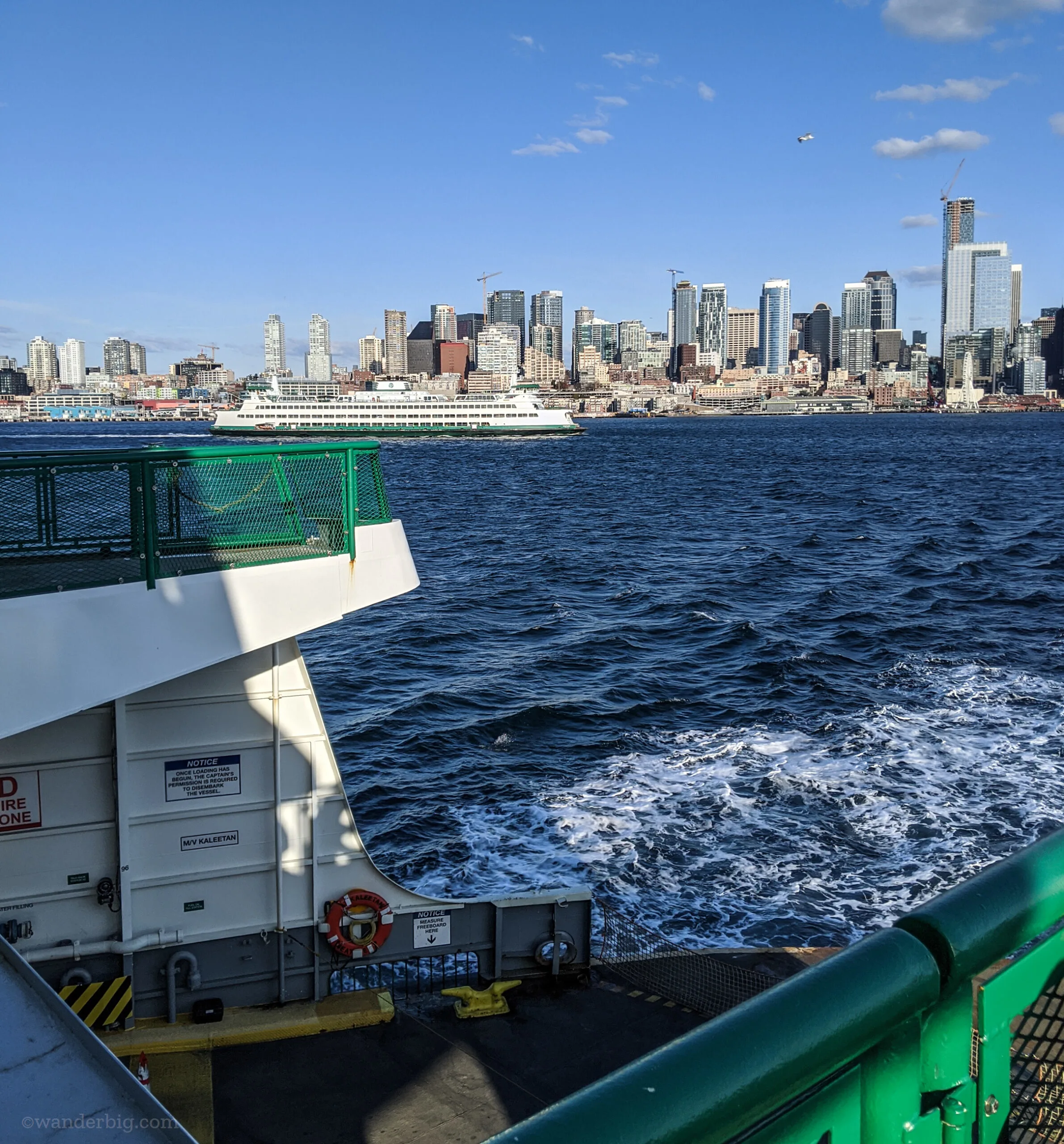 The seattle skyline as seen from an approach on the bainbridge to seattle ferry. Ferries are one way to navigate seattle without a car.