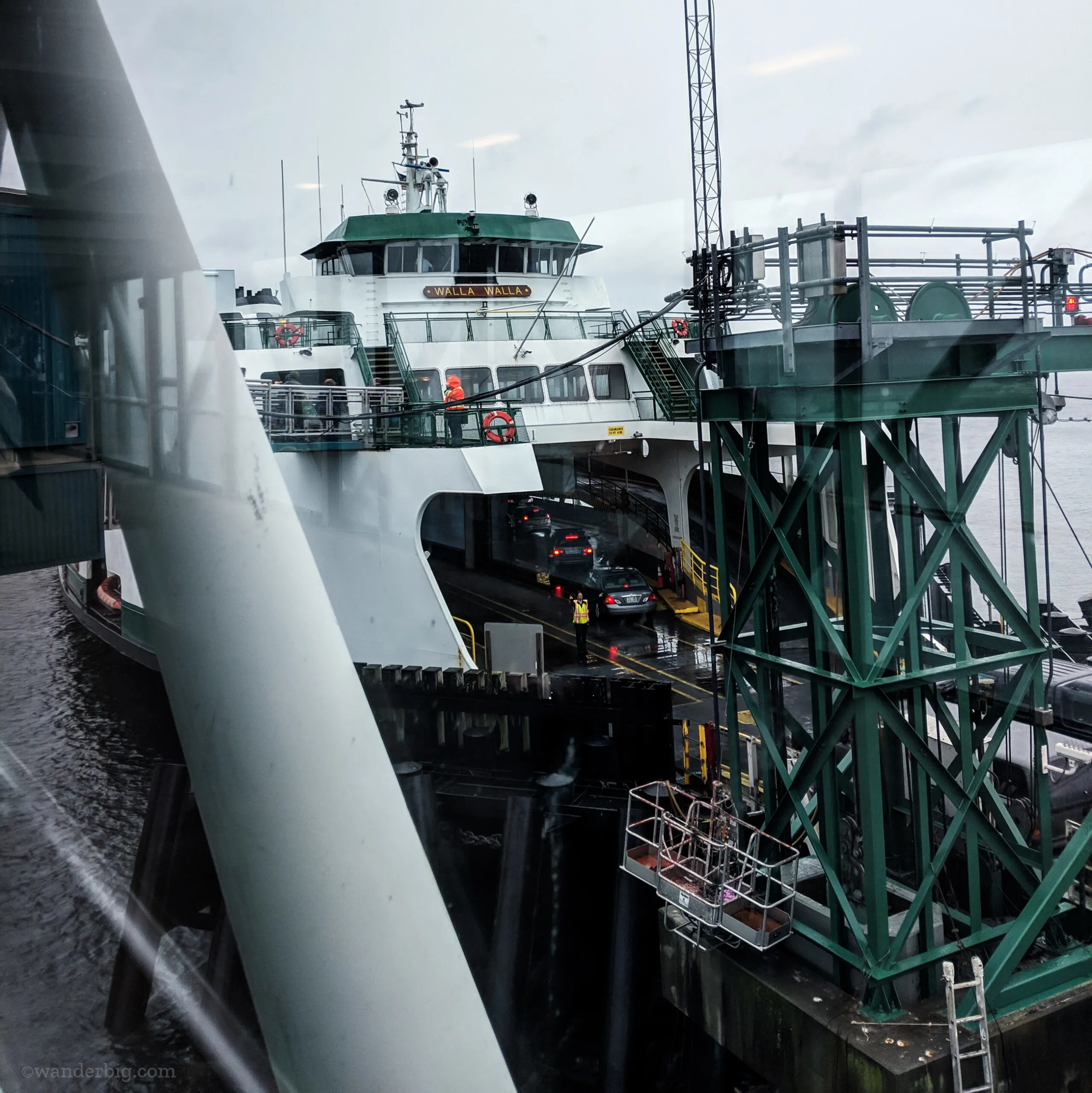 A docked ferry loading with cars in washington state.