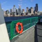 Seattle ferry boat pulling out of downtown seattle.