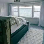 A bed overlooking the puget sound in an airbnb.