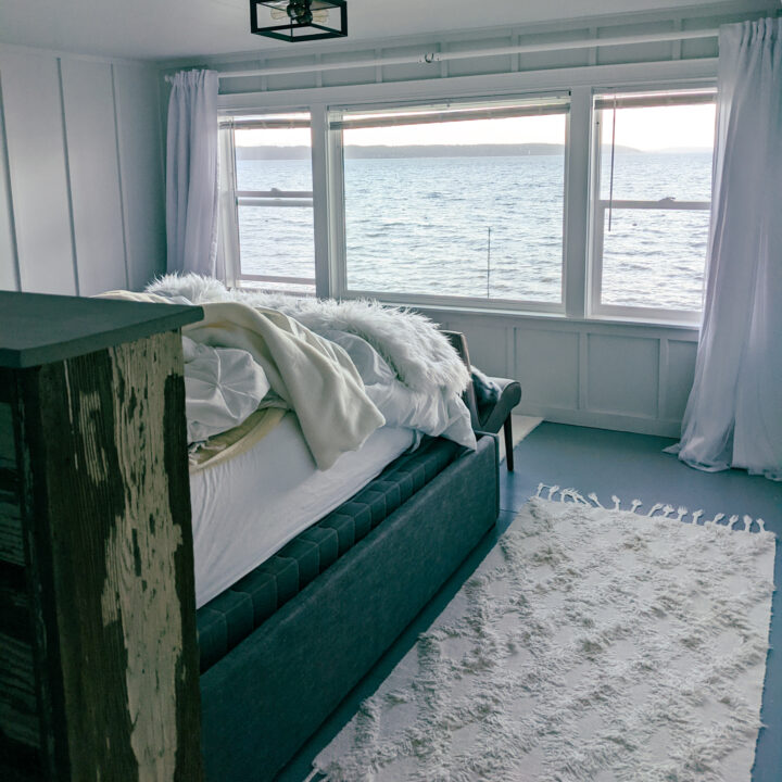 A bed overlooking the Puget Sound in an Airbnb.