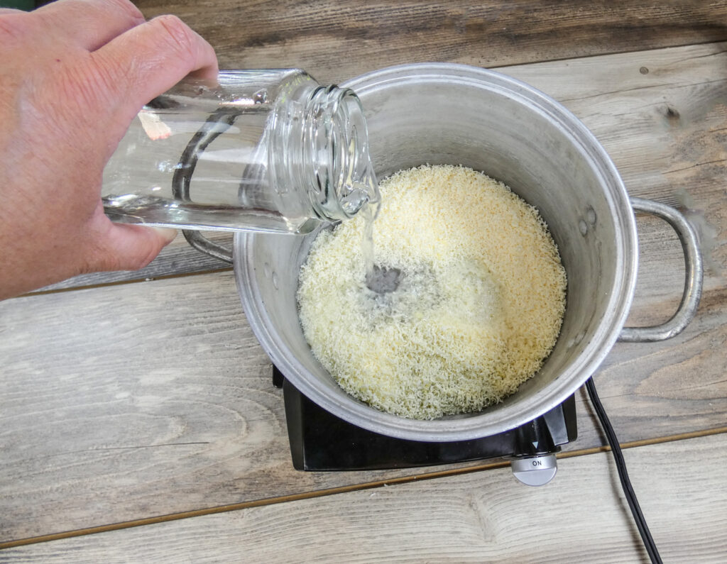 Add water to help the detergent melts into a smooth mixture.