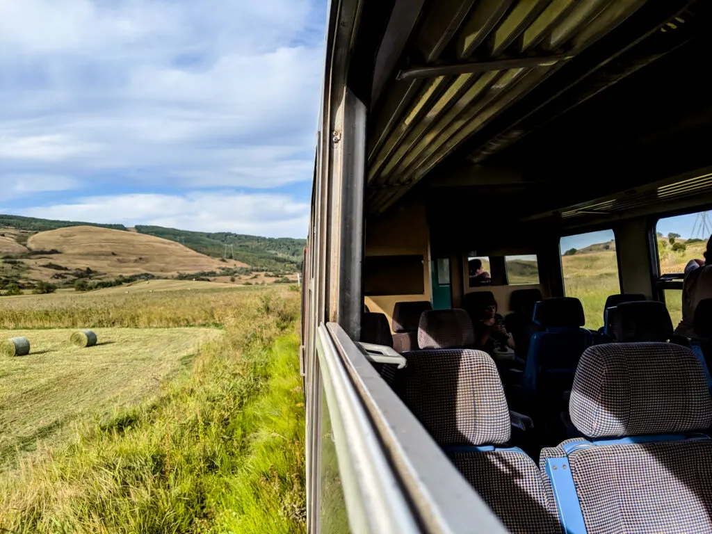 The view from a train in romania with the windows down.