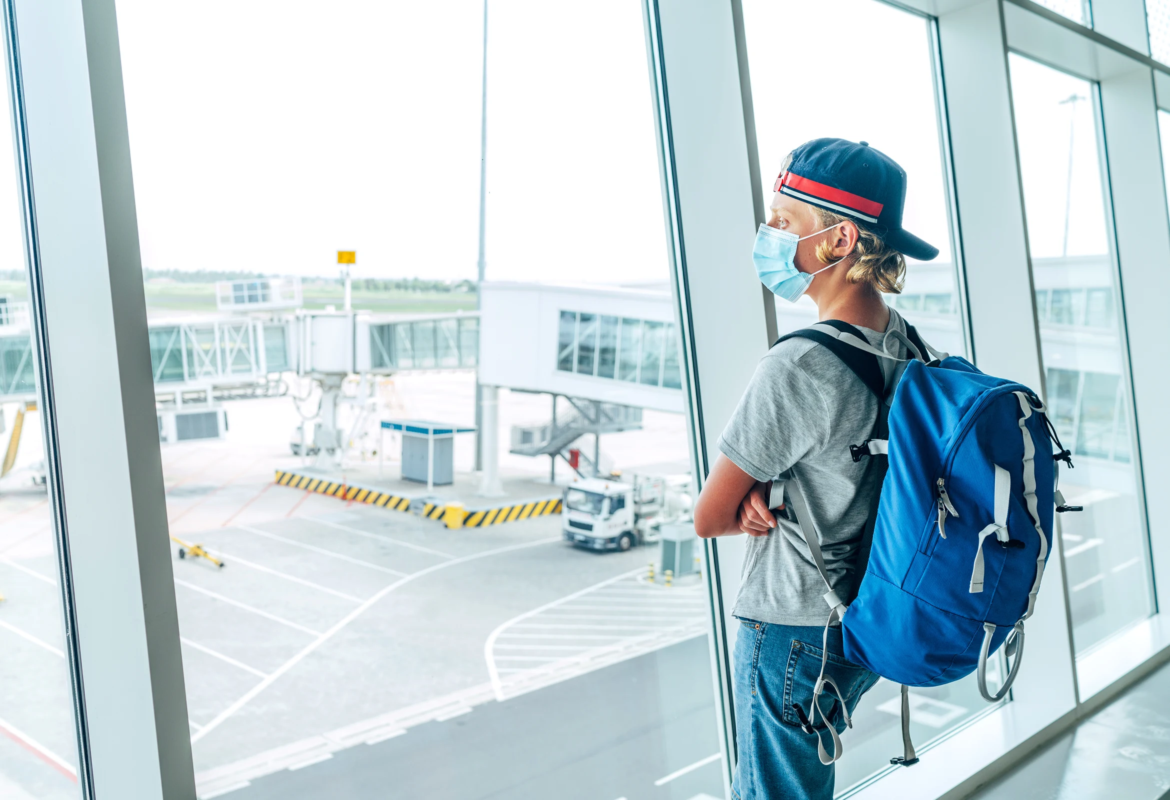 A teenage solo traveler in an airport.