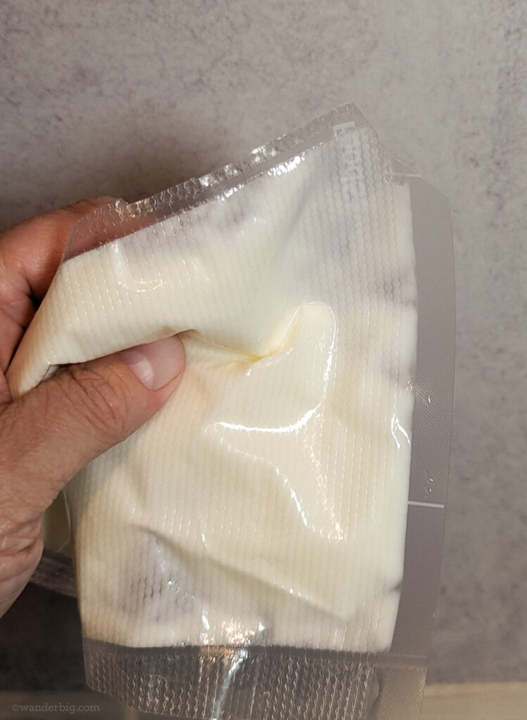 Melted deodorant in a plastic bag with the corner snipped off.