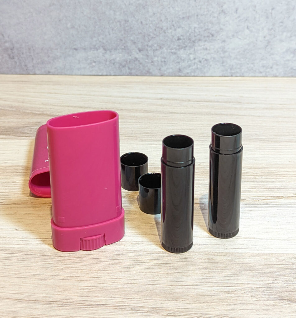 Empty chapstick containers and chafing bar container.