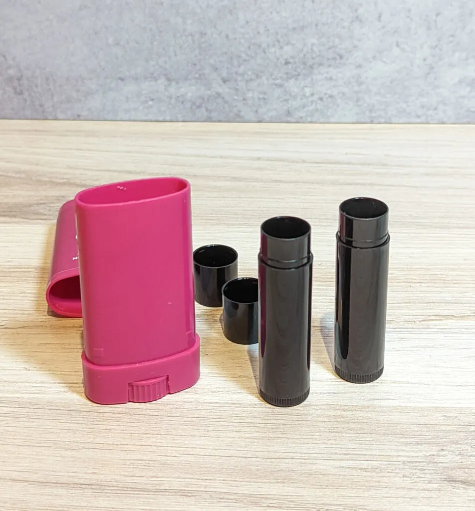 Empty chapstick containers and chafing bar container.