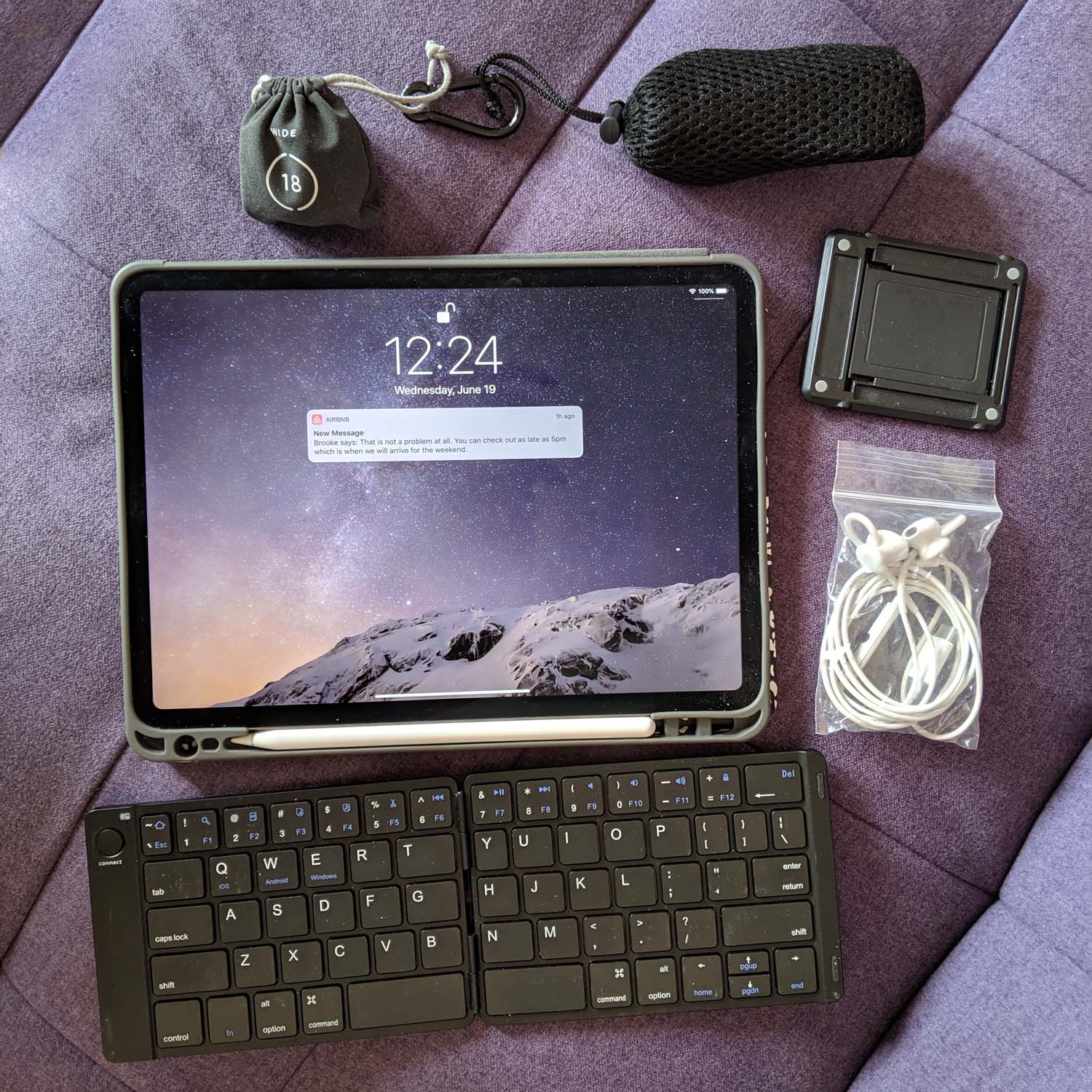 Portable blogging equipment on purple fabric.