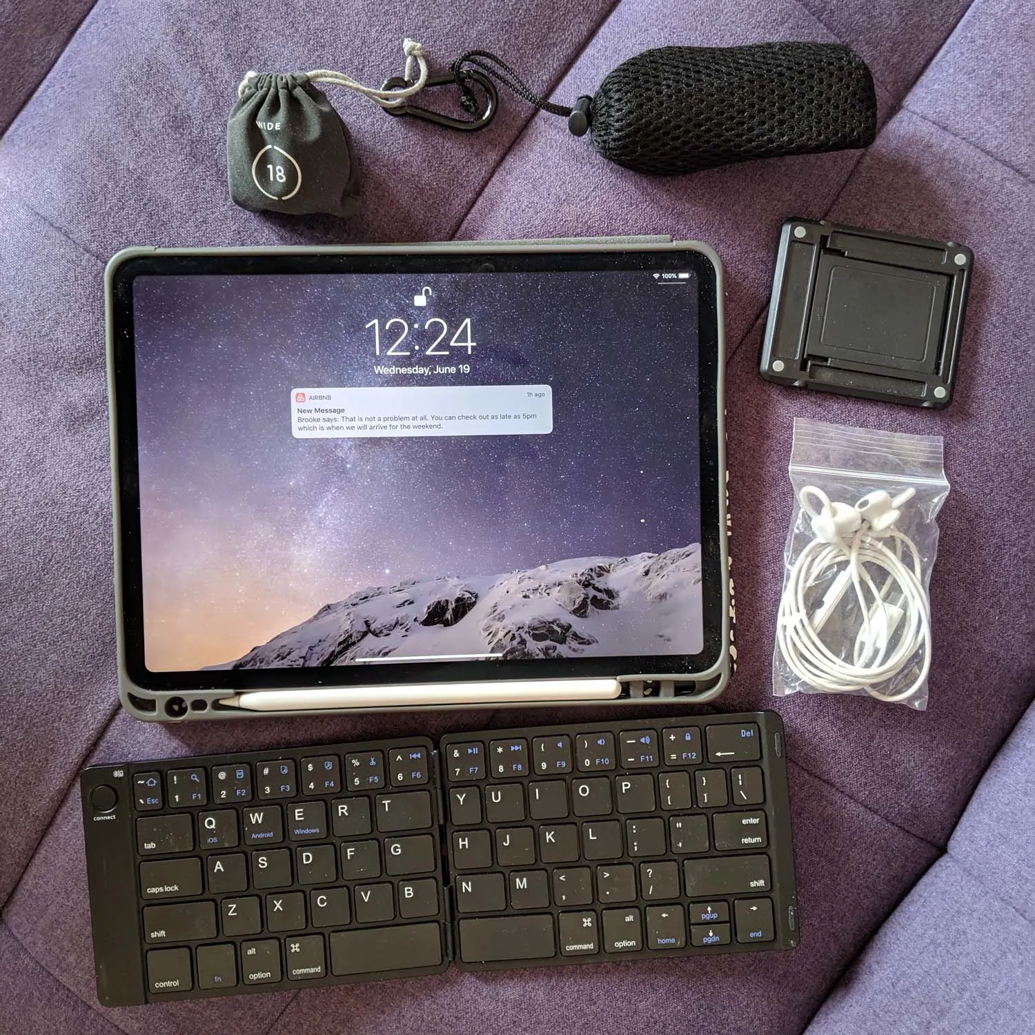 Portable blogging equipment on purple fabric.
