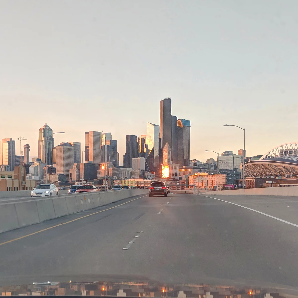 A view out the windshield while arriving to seattle by car.