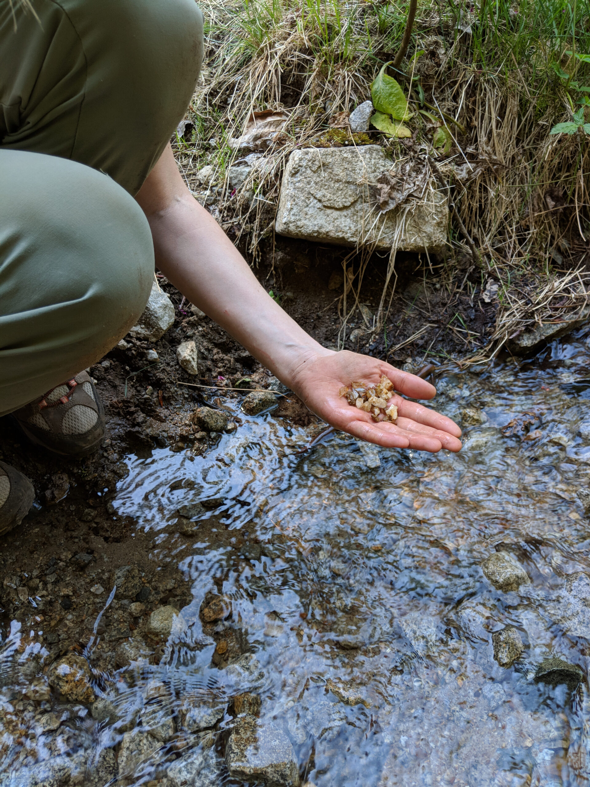 Crystals being washed in a mountain stream.